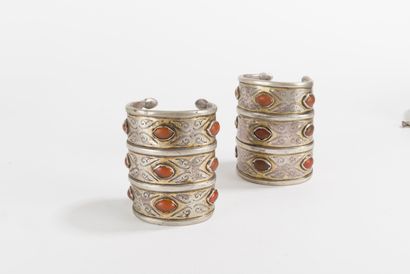 null Two open silver Yomud bracelets composed of three partially gilded registers,...