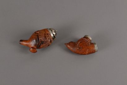 null Two pipe stoves in carved briar: one with a decoration of deer and running hinds...