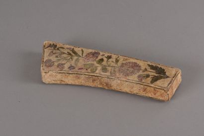 null A curved paper maché box decorated in arte povera with polychrome engravings...