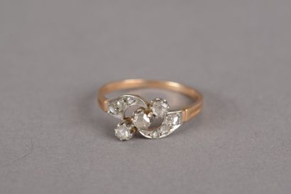 null Ring in pink gold 750 thousandths with a crossed motif and a central line of...