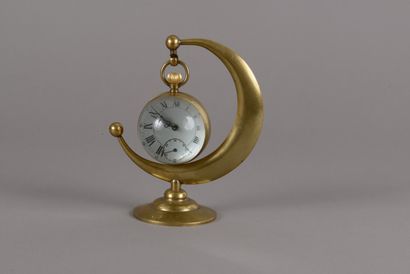 null Bronze moon-shaped watch holder on a round base, with its watch enclosed in...