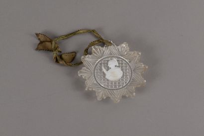null A twelve-pointed star-shaped cut glass pendant decorated with a portrait of...