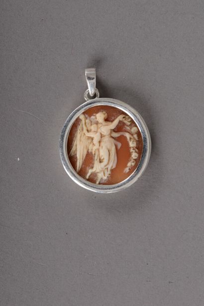 null Round silver pendant with a cameo representing a winged woman holding a crown...