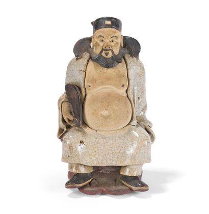 null STATUETTE OF A DIGNITARY IN GLAZED GRES WITH CRACKED GLAZE

China, 19th century.

Depicted...