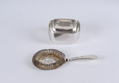 null A silver plated cocktail strainer from Christofle and a small square silver...