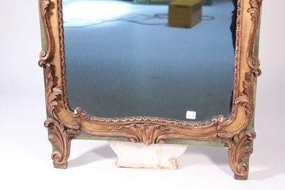 null Mirror, painted and gilded wood frame decorated with shells and foliage

Louis...