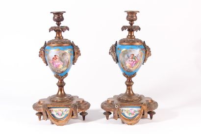 null Pair of porcelain candlesticks in the Sèvres style with polychrome decoration...