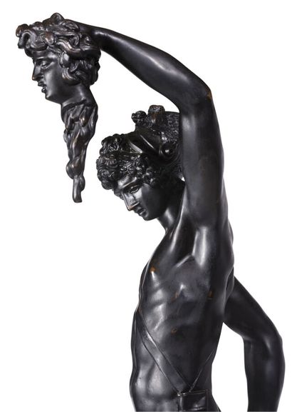 null FIGURE IN BRONZE WITH BROWN PATINA
representing Perseus, on a green Campan marble...