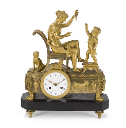 null CLOCK IN GILDED BRONZE
representing a mother playing with her son.
Empire period.
Total...