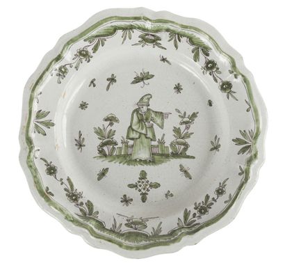 null BORDEAUX
EARTHENWARE PLATE
decorated in green monochrome in the center of a...