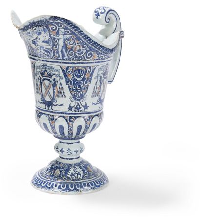 null ROUEN (KIND OF) EWER OF SHAPE HELMET OUT OF EARTHENWARE
decorated in blue and...