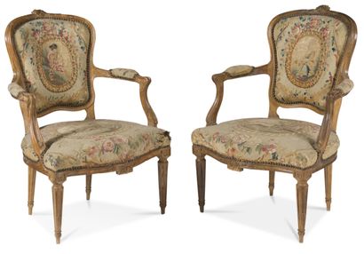 null SIX ARMCHAIRS AND A SOFA IN MOLDED AND CARVED BEECH
decorated with foliage and...