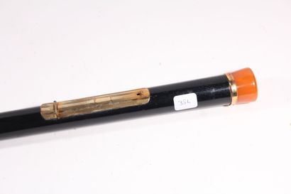 null Cane with system of smoker, the black wooden barrel opening to reveal a lighter...