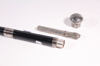 null Writer's cane, the shaft in black wood, set with two silver rings, the pommel...