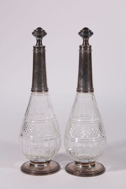 Pair of crystal carafes cut with points of...