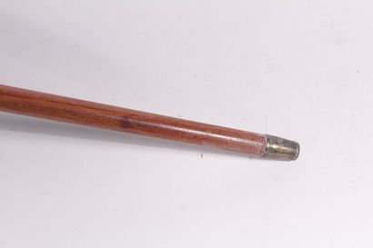 null Cane with system, the shaft in mahogany, the handle in silver in the shape of...