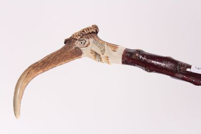 null Folk art cane, gnarled wood shaft, deer antler knob carved with a face. Length...