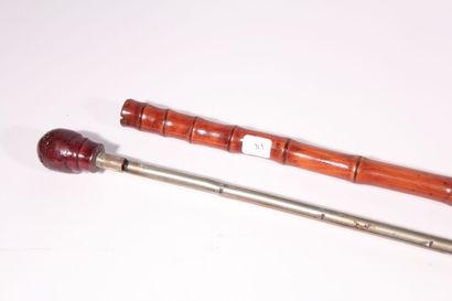 null Cane with smoking system, the bamboo shaft containing metal compartments for...