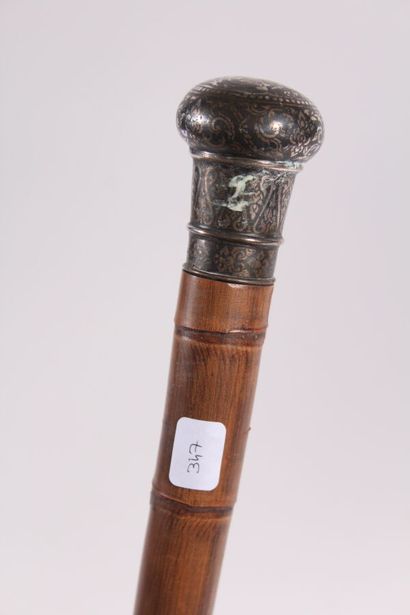 null Cane with system, the shaft in bamboo, the round pommel and the ferule in bidri,...