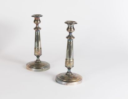 null Pair of silver plated metal torches with chased decoration of flowers and foliage...