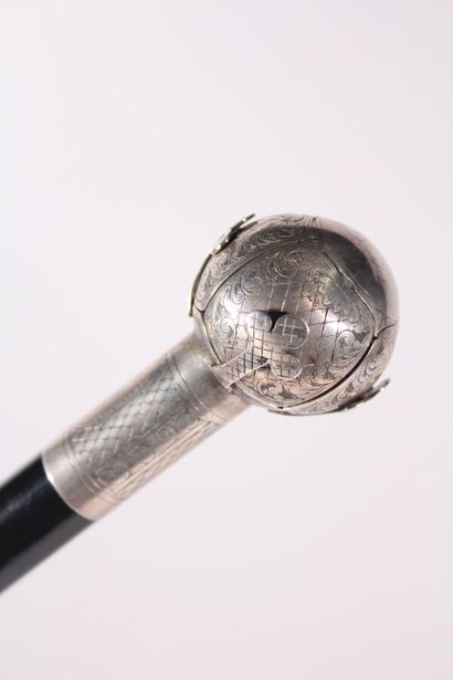 null Masonic cane, the shaft in black wood, the ring and the pommel ball in chased...