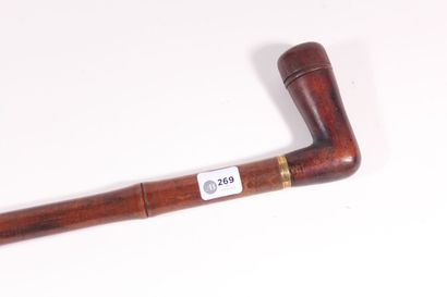 null Bamboo style wooden pipe, square handle, brass ring. Length 83,5 cm.