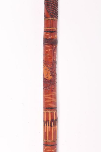 null Asian cane, the shaft in bamboo engraved with geishas and guilloche, the ring...