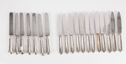 null A set of knives: twelve large knives, handles in silver plated metal decorated...