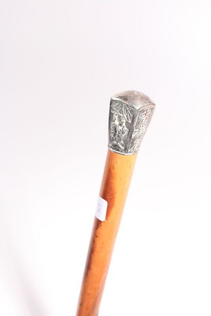 null Asian cane, the shaft in Malacca rush, the silver pommel with cut sides decorated...