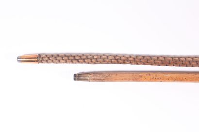 null Cane in wickerwork, knob with stick. Length 85,4 cm. A child's cane is attached,...