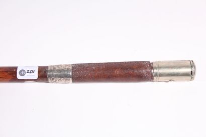 null Cane, the shaft in exotic wood, the top decorated with silver ring, covered...