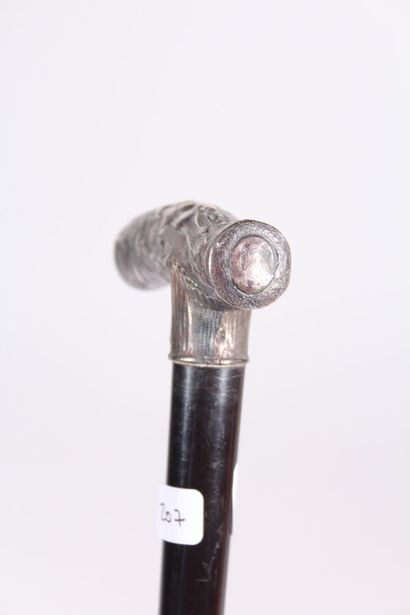 null Cane, the shaft in black wood, the pommel square silver Art Nouveau with plant...