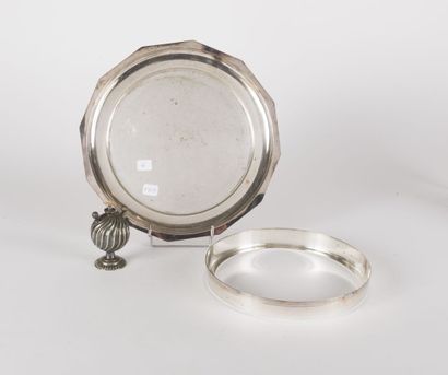 A round silver plated dish with cut edges,...