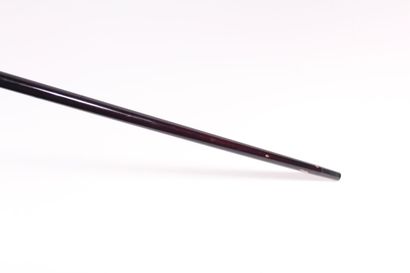 null Asian cane, the shaft in black lacquered wood, the knob in silver decorated...
