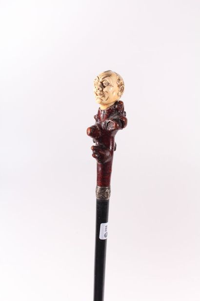 null Cane, the shaft in black wood decorated with a silver ring, pommel in briar...