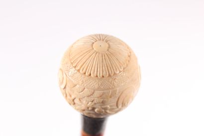 null Asian cane, the shaft in bamboo engraved with geishas and guilloche, the ring...