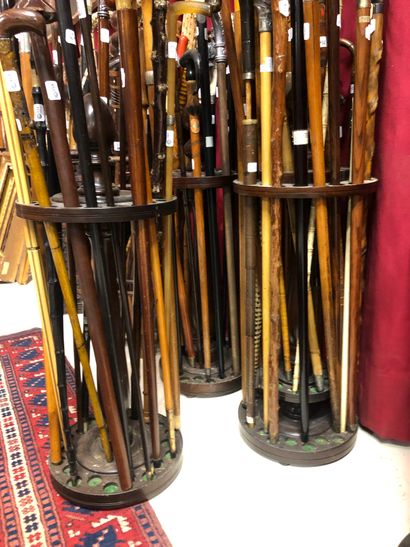 null Seven round wooden cane stands. A turned element is missing from the center...