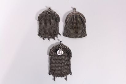 Two silver purses with floral decoration,...