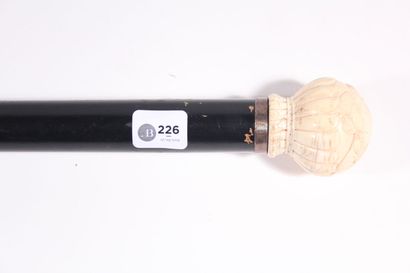 null Cane in blackened wood, ball knob in ivory carved with an erotic scene of kiss,...