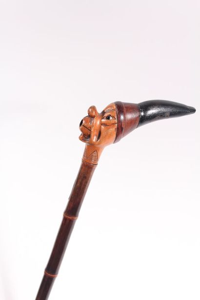 null Folk art cane, bamboo shaft, the pommel carved with a face of an elf with an...