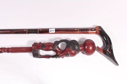 null A two-tone exotic wood cane with mother-of-pearl inlays, Xth century. Length...