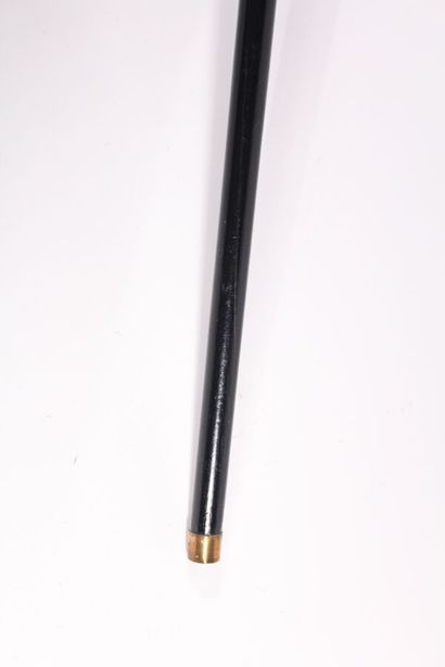 null Asian cane, the shaft in ebony, the pommel Milord in ivory decorated with three...