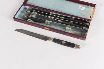 null Six large knives, the ebony handles decorated with a numbered escutcheon, the...