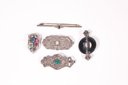 A clip and four Art Deco silver brooches...
