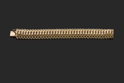 null Flexible bracelet in yellow gold 750 thousandths American mesh, clasp with ratchet...