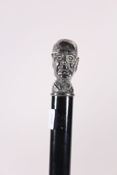 null Electoral cane, the shaft in black wood, the knob janus in silver plated metal...