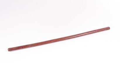 Baton sheathed in leather. Length 62 cm.