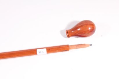 null Blond wood cane, the ovoid handle unscrewing to reveal a pencil, the shaft engraved...