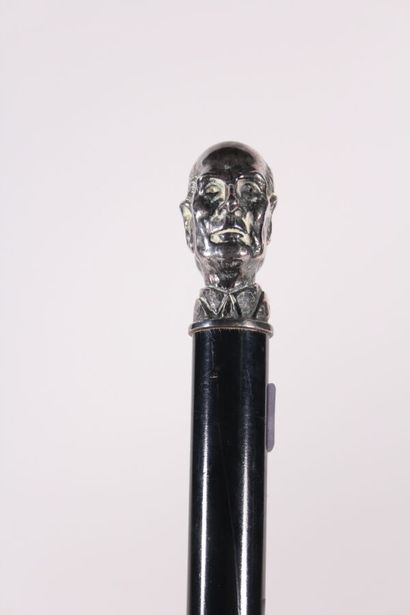null Electoral cane, the shaft in black wood, the knob janus in silver plated metal...