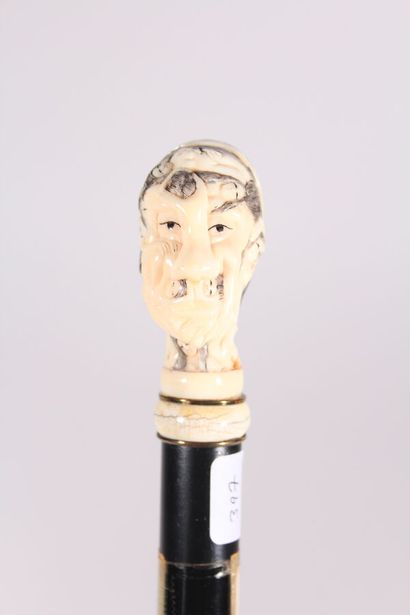 null Erotic cane, the shaft in black wood, the handle in ivory in the shape of an...